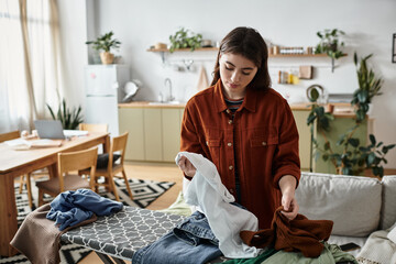 Struggling with emotions while managing daily chores in a calm living space
