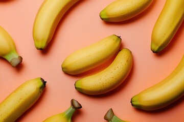Fresh bananas arranged on a pink surface