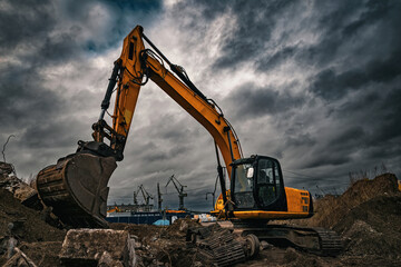 Excavator and cranes in the Gdansk Stocznia, old shipyard
