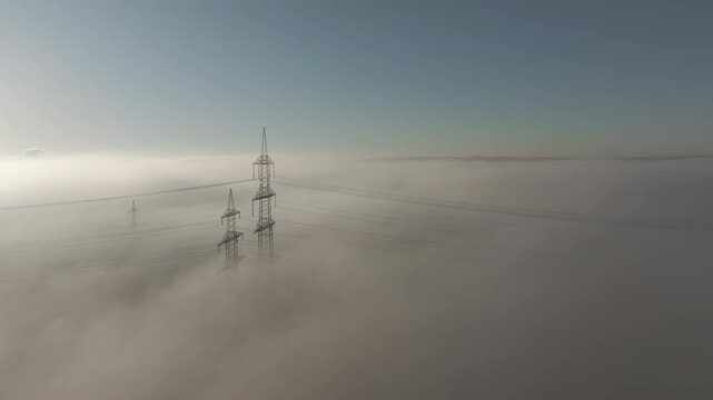 Pylon in fog in the eary morning. Drone view video footage