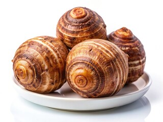 Three whole taro roots, meticulously arranged, rotate against a stark white backdrop for macro photography.