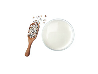 Job's tears milk with job's tears seed glass and spoon isolated on white background. top view.
