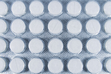 White pills in blister pack top view
