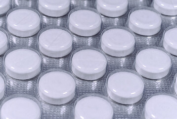 White tablets in silver blister pack