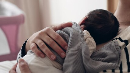 Quiet Maternal Moments - Mother Trying to Rest with Newborn Asleep on Her During First Week of Life