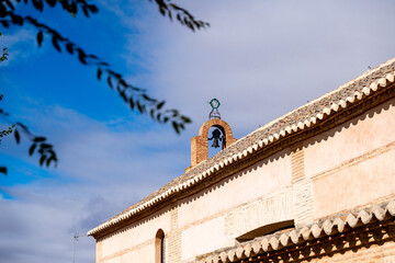 Ermita de San Juan chapel with bell tower and blue sky