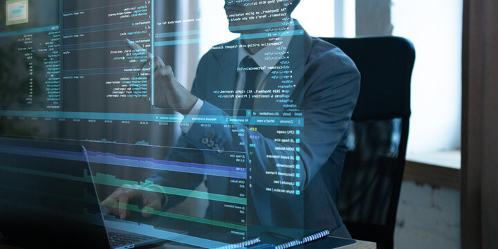 Man in suit using futuristic virtual interface with lines of fictional code and performance analysis. Floating screen overlay suggests advanced digital technology. Concept of IT engineering