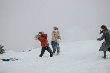 A group of three friends enjoying a playful snowball fight amidst a snowy landscape, exhibiting joy...