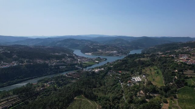 Footage that shows the portuguese region of Entre-os-Rios, from a far upview, so it shows the entire region, including the rivers, bridges and several mountains.