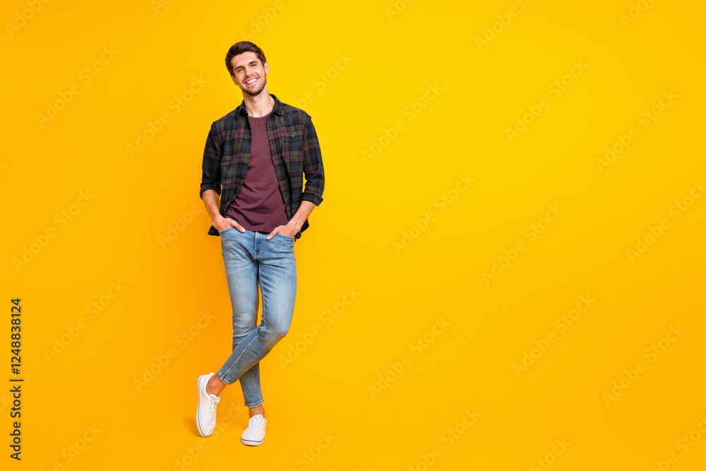 Poster Full length body size photo of cheerful charming cute handsome man posing in front of camera with hands in pockets isolated over vivid color background