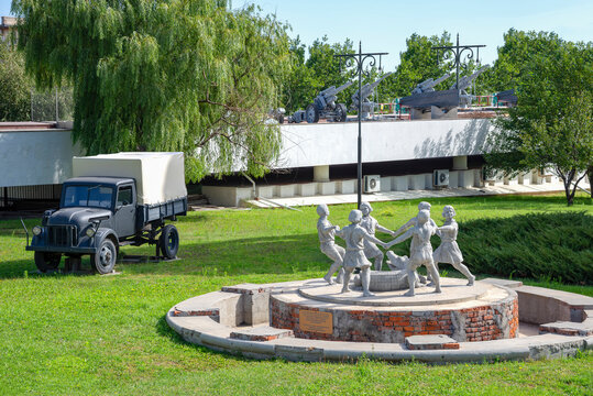 VOLGOGRAD, RUSSIA - SEPTEMBER 19, 2021: Sculpture composition "Children's Round dance" and a German truck next to the Gergardt mill. Volgograd