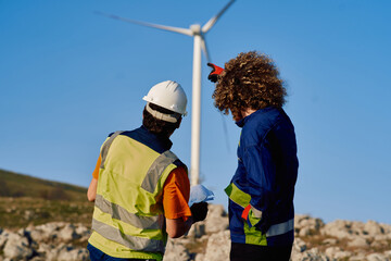 Engineer and Colleague Reviewing a Wind Turbine Project.