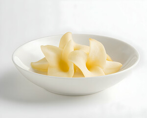 Sliced Pears Radiating Light in Ceramic Bowl, Representing Healthy Eating and Natural Goodness Against a Bright Background