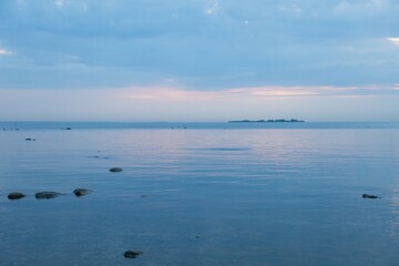 Obraz premium blue, clear water and sky during sunset