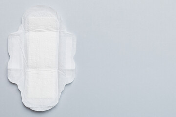 Women hygiene products or sanitary pad on colored background. Pastel color. Closeup. Empty place for text. Female daily hygiene