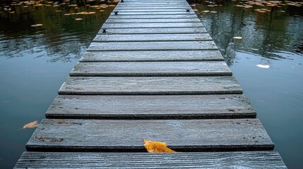 Obraz premium Serene Wooden Dock on a Calm Lake: An Autumn Reflection