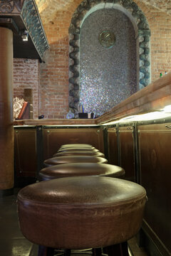 Row of leather seats in a bar or nightclub. 