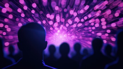 silhouette of people watching purple lights show