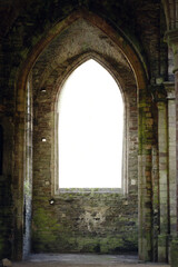 Fototapeta premium High arched windows with tracery in an abandoned Gothic building