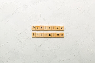 positive thinking word written on wood block. positive thinking text on table, concept