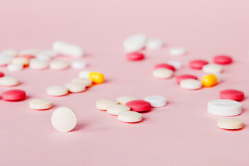 Many different colorful medication and pills perspective view. Set of many pills on colored...