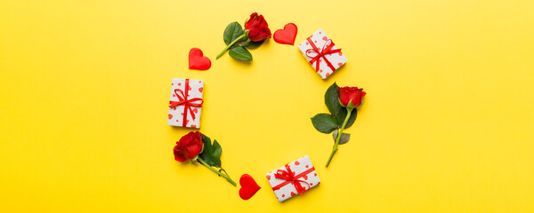 Heart made of rose, git box, heart and blank greeting card mockup on Colored background. Top view, flat lay, copy space Holiday, Mothers Day, birthday concept