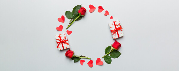 Heart made of rose, git box, heart and blank greeting card mockup on Colored background. Top view, flat lay, copy space Holiday, Mothers Day, birthday concept