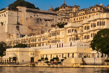 India. Rajasthan. Udaipur.  The City Palace view from the Pichola Lake at dusk