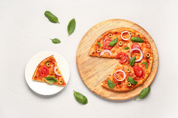 Board and plate with tasty pizza on grey background
