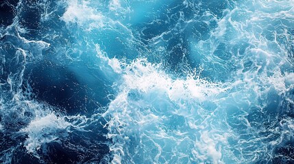 Fototapeta premium Ocean waves, top view, turquoise and dark blue water, foamy white splashes.