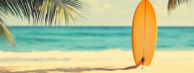 Orange surfboard on tropical beach, ocean background, summer vacation