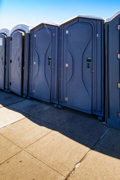 Row of portable restrooms at a reststop area on Route 90 in Washington state.
