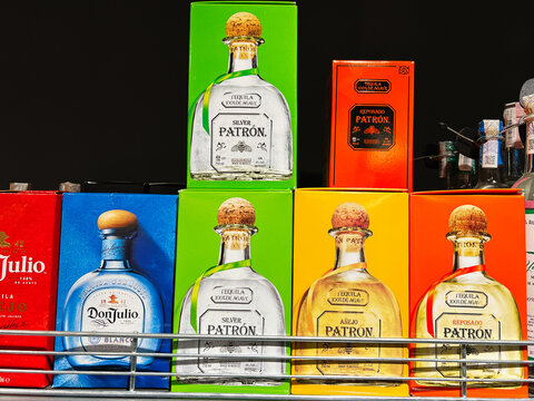 Kyiv, Ukraine - February 04, 2025: Colorful tequila boxes displayed on shelves in a liquor store
