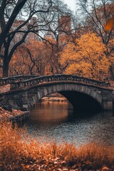 Obraz premium A historic stone bridge arching over a quiet river