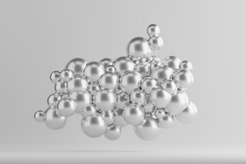 Floating silver spheres create an abstract design