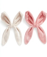 Two small decorative bows are placed next to each other on a clean white surface, showcasing their vibrant colors and intricate designs.