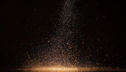 Fototapeta premium gold dust particles floating in dark background for luxury, festive, and abstract design elements or textured overlay
