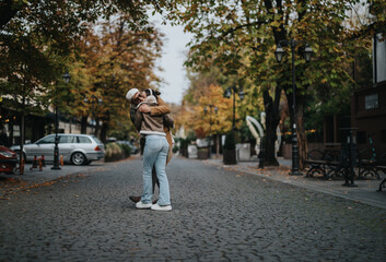Fototapeta premium A happy couple shares a warm embrace on a charming cobblestone street lined with colorful autumn trees. The peaceful outdoor setting enhances the loving and joyful atmosphere.