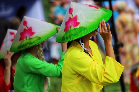 Young woman in a traditional Vietnamese hat.