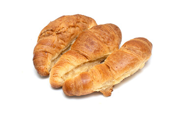 Three croissants are sitting on a white background