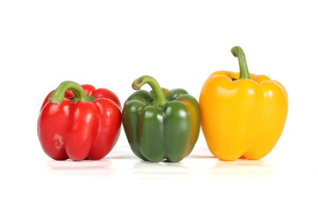 3 peppers lined up on a white background