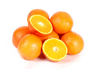 Whole and sliced oranges isolated on a white background