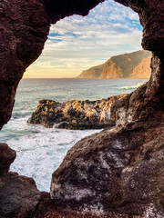 view through the hole in the stones of the coast in Los Gigantos area, Tenerife, Canary Islands