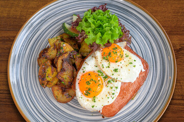 food, baked meatloaf with fried eggs and roast potatoes