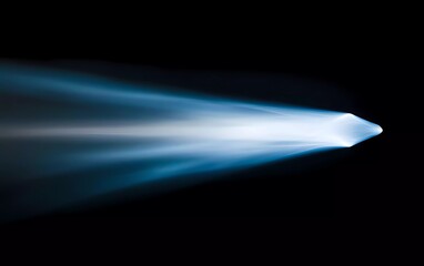 A soft, blurred light beam with an abstract shape on a black background. The light is white and has blue edges. 