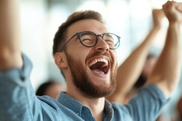 Fototapeta premium excited man celebrating with arms raised