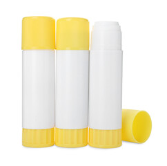 Many different glue sticks isolated on white