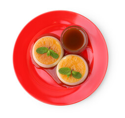 Tasty puddings with caramel sauce and mint isolated on white, top view