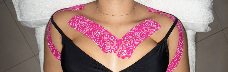 tapes stuck to the body of a woman with figure, concept of reduction and body care