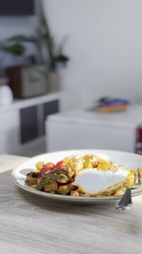 Delicious breakfast plate with eggs and vegetables